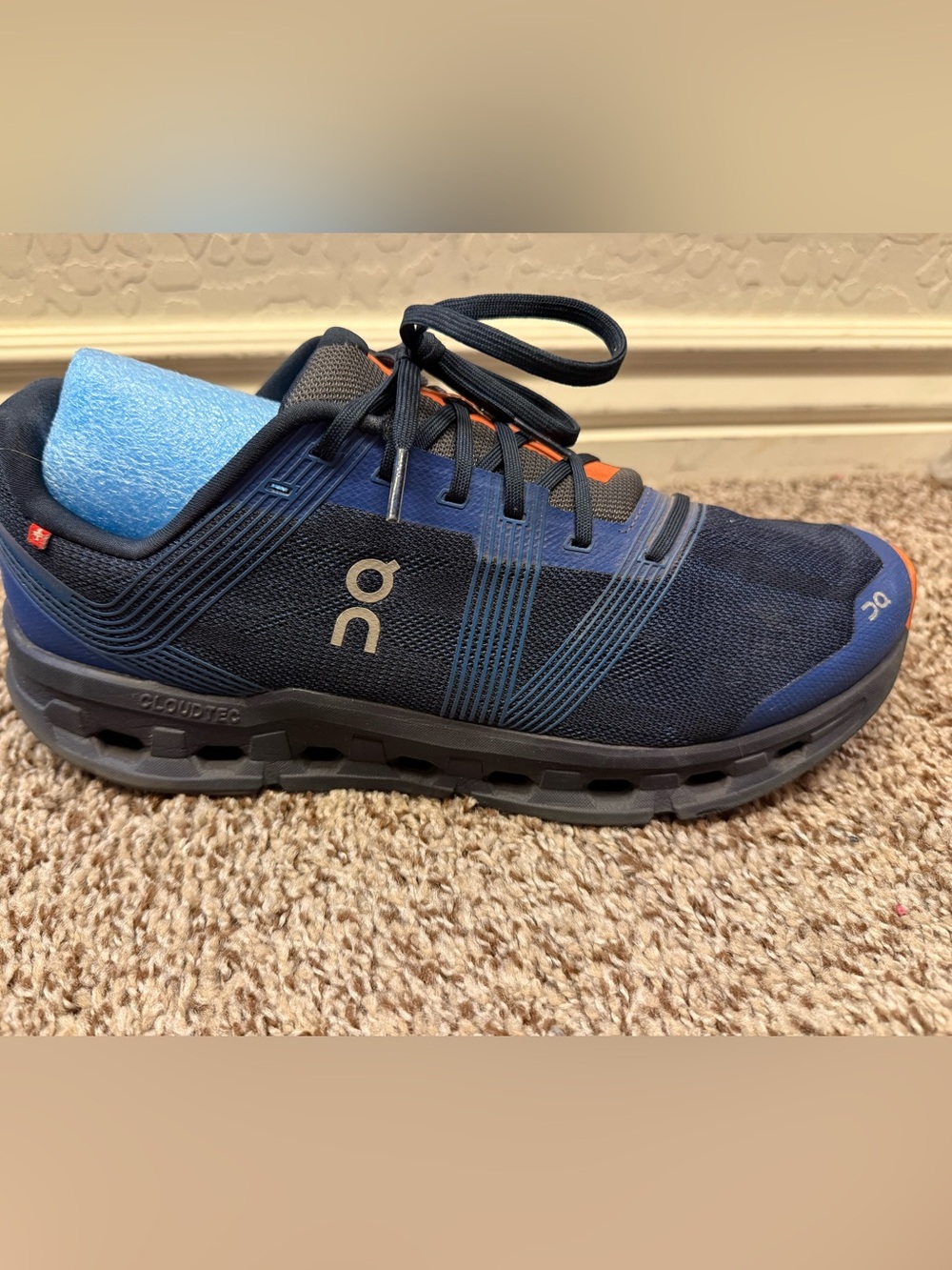 On Running Men’s Navy and Black Cloudtec Trainer with Orange Accents